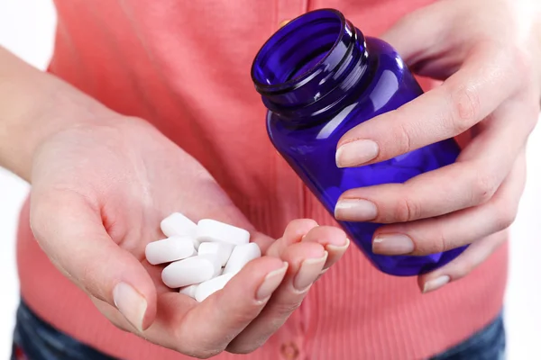 Pills in hand of woman — Stock Photo, Image