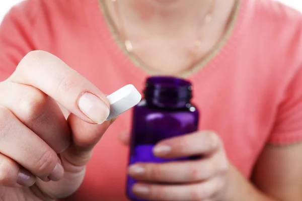 Pill in hand of woman — Stock Photo, Image