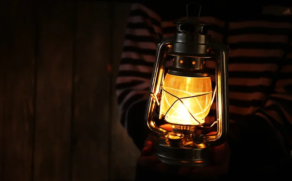 Lantern in hands in darkness — Stock Photo, Image