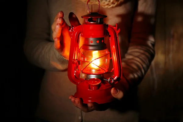 Lantern in hands in darkness — Stock Photo, Image