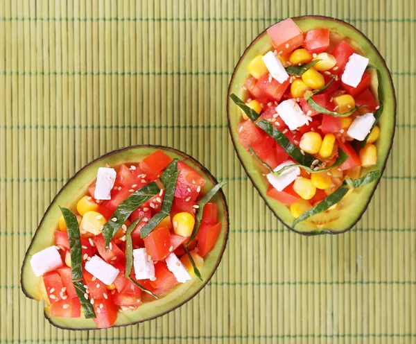 Tasty salad in avocado — Stock Photo, Image