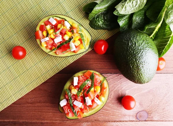 Tasty salad in avocado — Stock Photo, Image