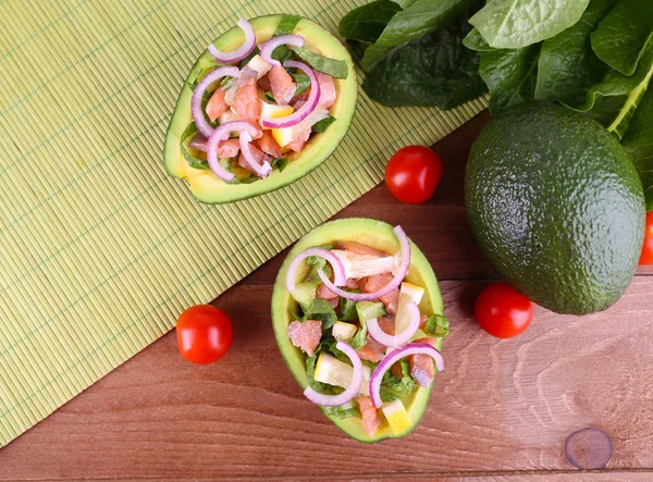 Tasty salad in avocado — Stock Photo, Image