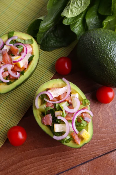 Tasty salad in avocado — Stock Photo, Image