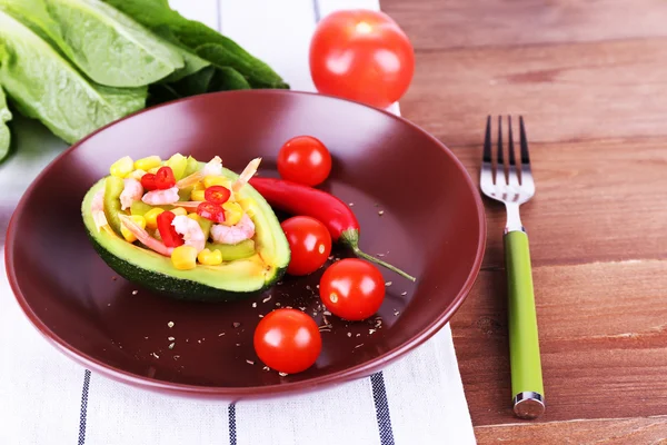 Tasty salad in avocado — Stock Photo, Image