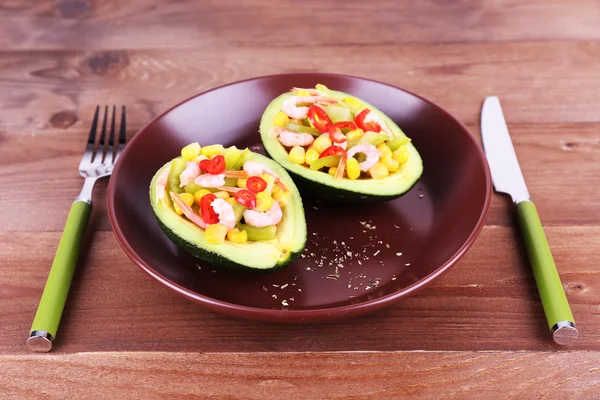 Tasty salad in avocado — Stock Photo, Image