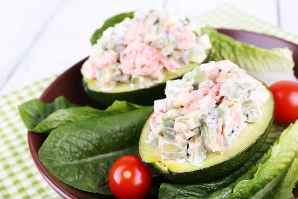 Tasty salad in avocado — Stock Photo, Image