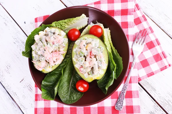 Tasty salad in avocado — Stock Photo, Image