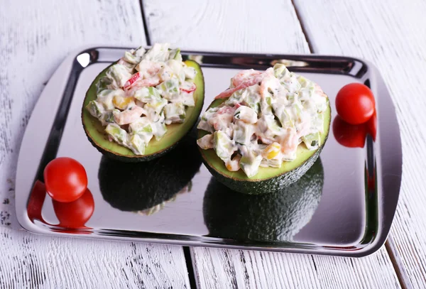 Tasty salad in avocado — Stock Photo, Image