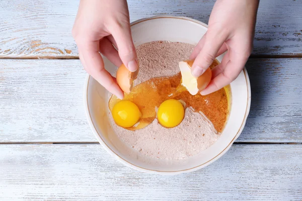 Mixing eggs and flour in bowl hi-res stock photography and images