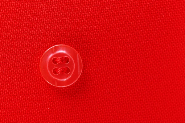 Botão em pano vermelho, close-up — Fotografia de Stock