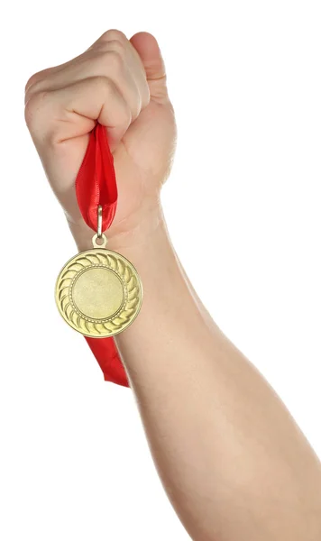 Золотая медаль в руке — стоковое фото