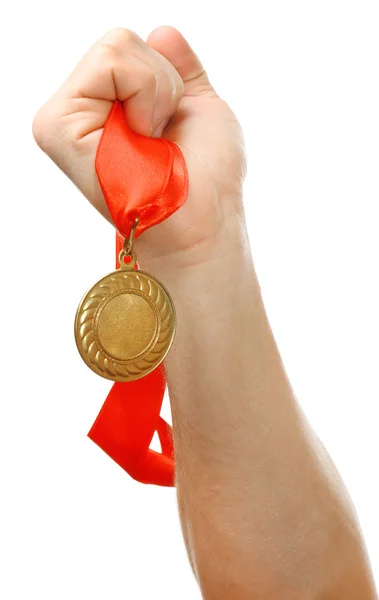 Golden medal in hand — Stock Photo, Image