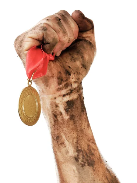 Gouden medaille in de hand — Stockfoto