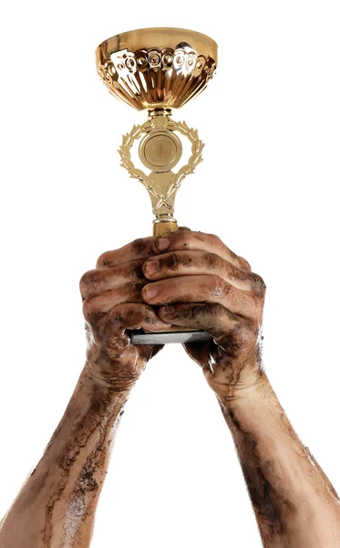 Gold cup in dirty hands — Stock Photo, Image