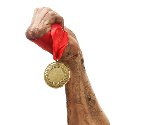 Golden medal in hand — Stock Photo, Image