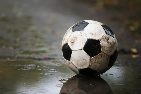 Soccer ball on ground — Stock Photo, Image