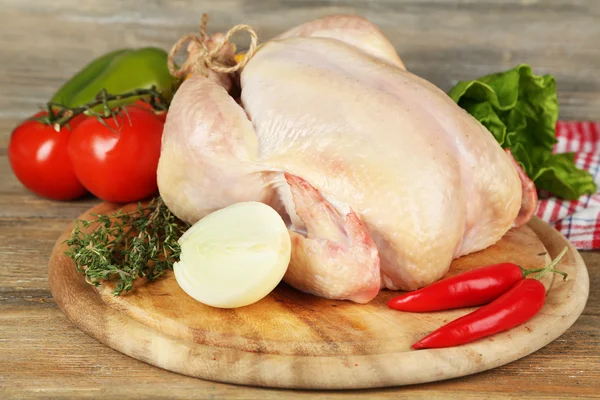 Raw chicken on table — Stock Photo, Image