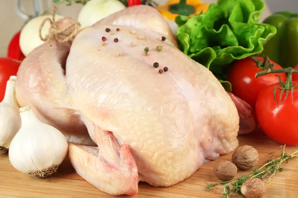 Raw chicken on table — Stock Photo, Image