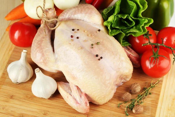 Raw chicken on table — Stock Photo, Image