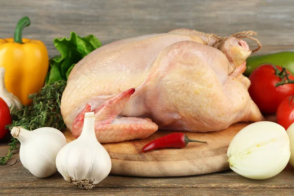 Raw chicken on table — Stock Photo, Image