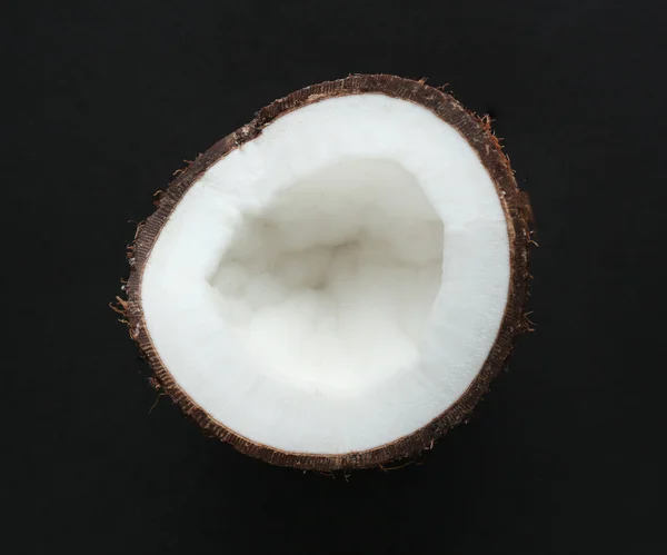 Coconut on black background — Stock Photo, Image