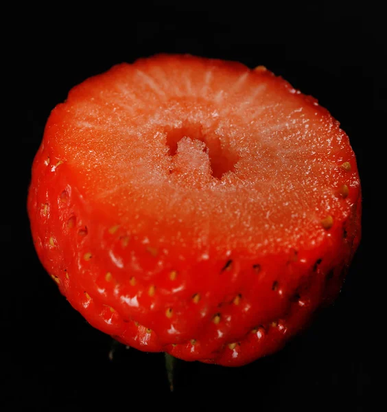 Strawberry slice on black background — Stock Photo, Image