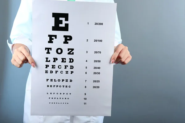 Woman with eye chart — Stock Photo, Image