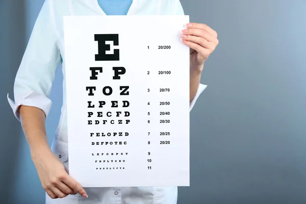 Woman with eye chart — Stock Photo, Image