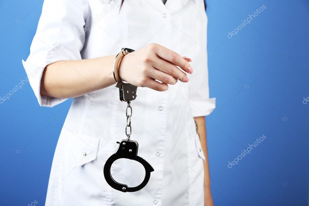 Female hand is handcuffed