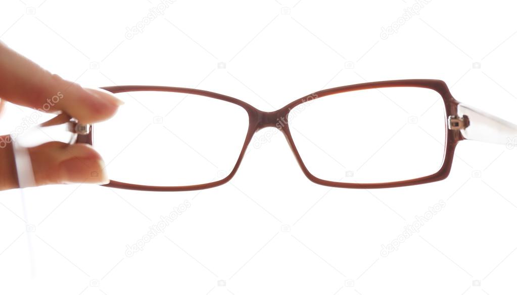 Eye glasses in human hand