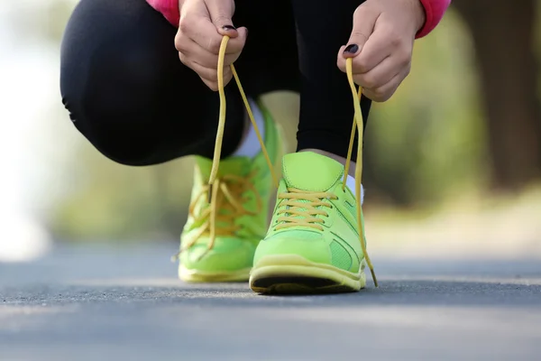 Runner's feet on road — Stock Photo, Image