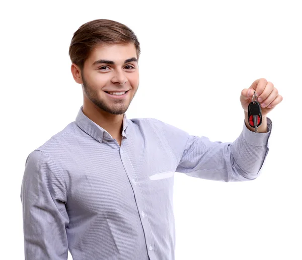 Empresário segurando chave do carro isolado em branco — Fotografia de Stock