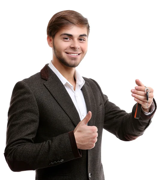 Empresário segurando chave do carro isolado em branco — Fotografia de Stock