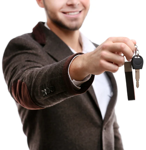 Businessman holding car key isolated on white — Stock Photo, Image