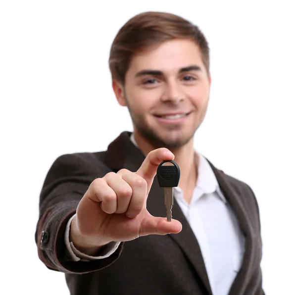 Businessman holding car key isolated on white — Stock Photo, Image