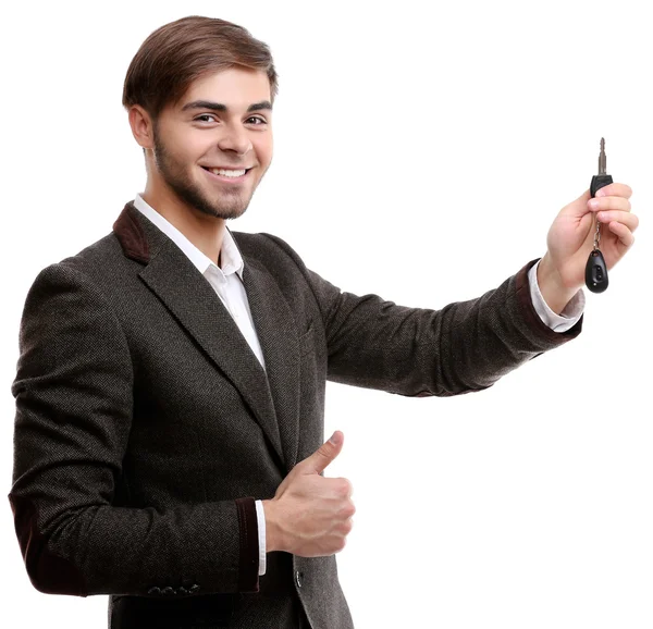Empresario sosteniendo llave de coche aislado en blanco — Foto de Stock