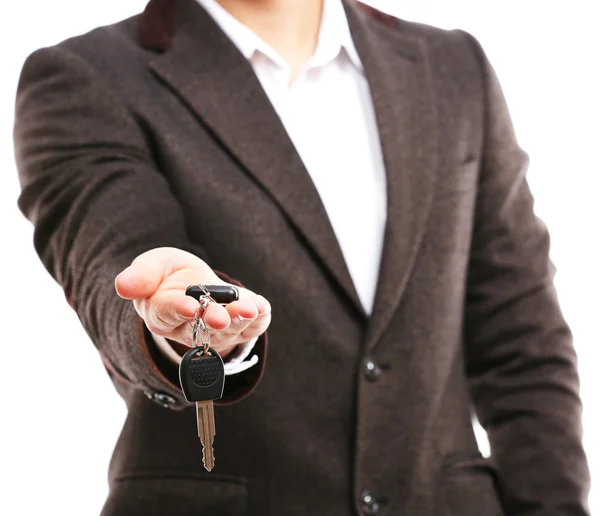 Biznesmen trzymając kluczyk — Zdjęcie stockowe