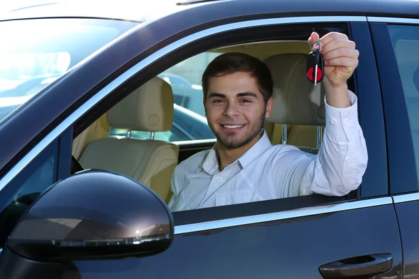 Young man in car — Stock Photo, Image