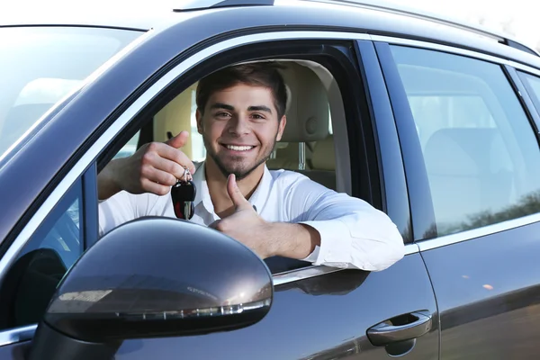 Young man in car — Stock Photo, Image