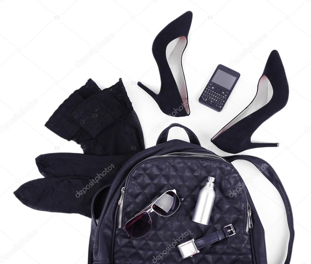 Female bag, shoes and accessories isolated on white