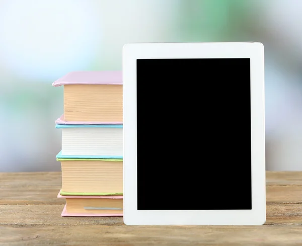 PC tablet and books on table — Stock Photo, Image