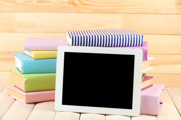 PC tablet and books on table — Stock Photo, Image