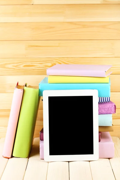 PC tablet and books on table — Stock Photo, Image
