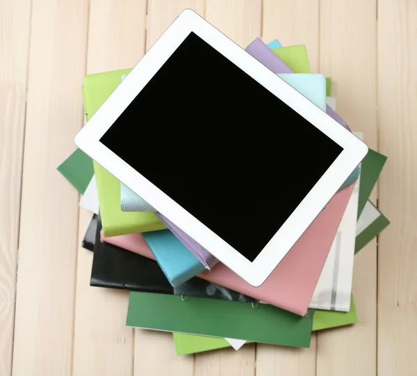 PC tablet and pile of books — Stock Photo, Image