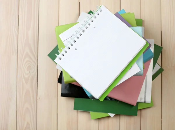 Notebook and pile of books