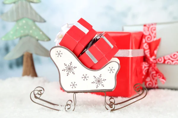 Toy sledge with Christmas gifts — Stock Photo, Image