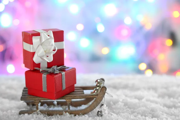 Toy sledge with Christmas gifts — Stock Photo, Image