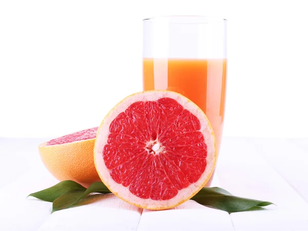 Грейпфрутовый сок и свежий грейпфрут — стоковое фото