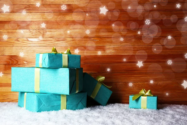 Gift boxes on wooden background — Stock Photo, Image